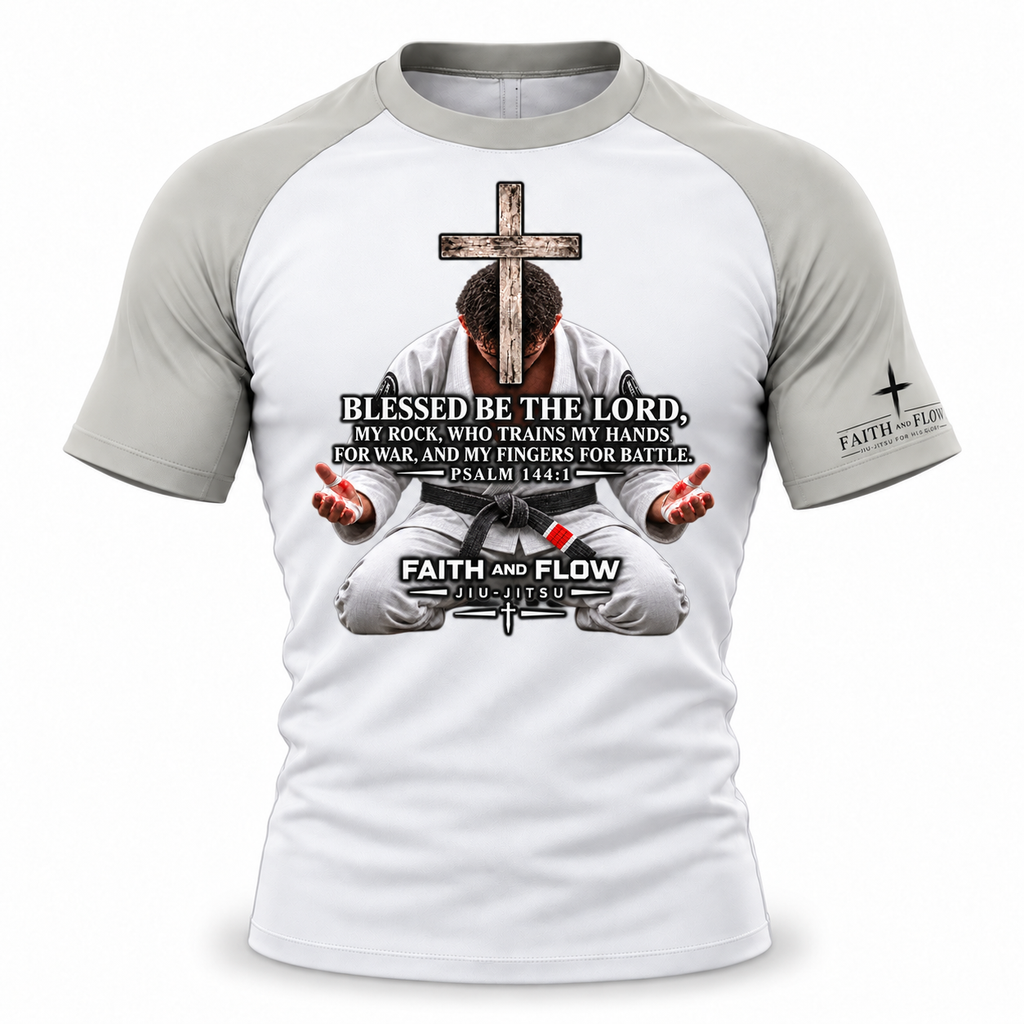 A white and gray raglan baseball t-shirt with a detailed graphic on the front showing a man in a white gi seated under a wooden cross, with the text 'BLESSED BE THE LORD, MY ROCKS WHO TRAINS MY HANDS, MY FINGERS FOR BATTLE, PSALM 146:1-4' and 'FAITH AND FLOW' printed on the sleeve.